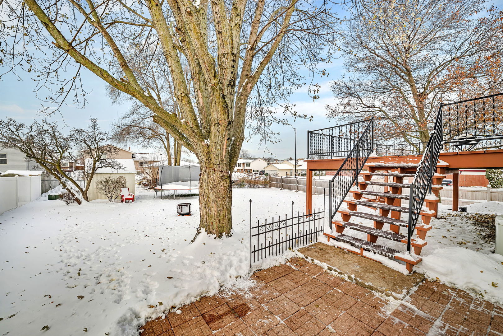 700 Evergreen Court Romeoville, IL 60446 - Photo 24 of 27 a view of a yard covered with snow in front of house