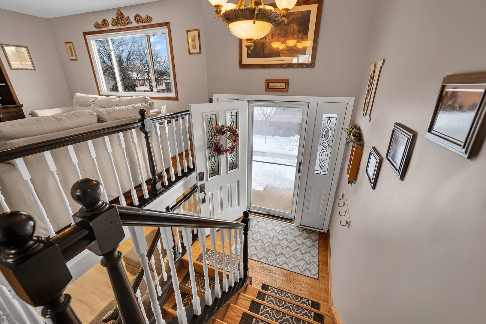 700 Evergreen Court Romeoville, IL 60446 - Photo 4 of 27 a view of a balcony with furniture and hardwood floor