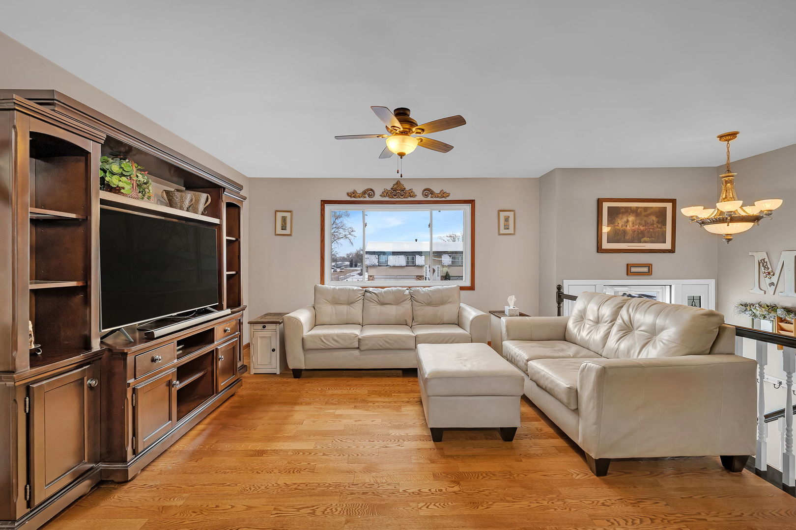 700 Evergreen Court Romeoville, IL 60446 - Photo 6 of 27 a living room with furniture and a flat screen tv