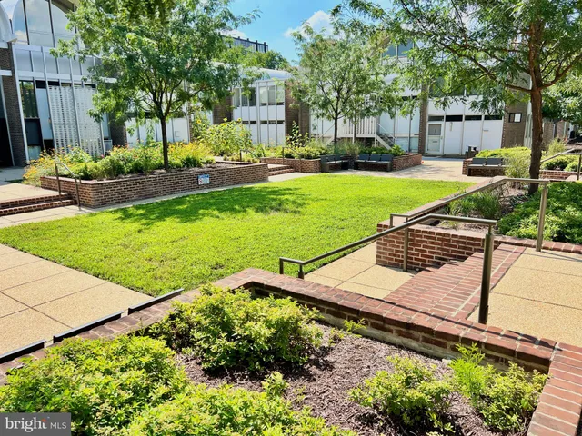 a view of a backyard with sitting area