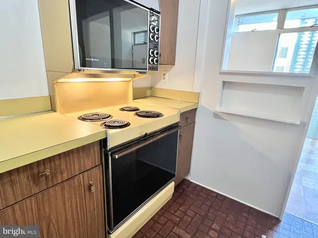 a kitchen with a stove and a microwave