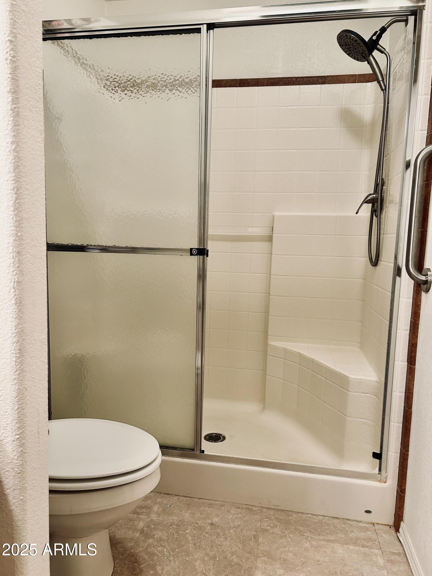 3301 South Goldfield Road, Unit 3011 Apache Junction, AZ 85119 - Photo 18 of 65 a bathroom with a shower and a toilet