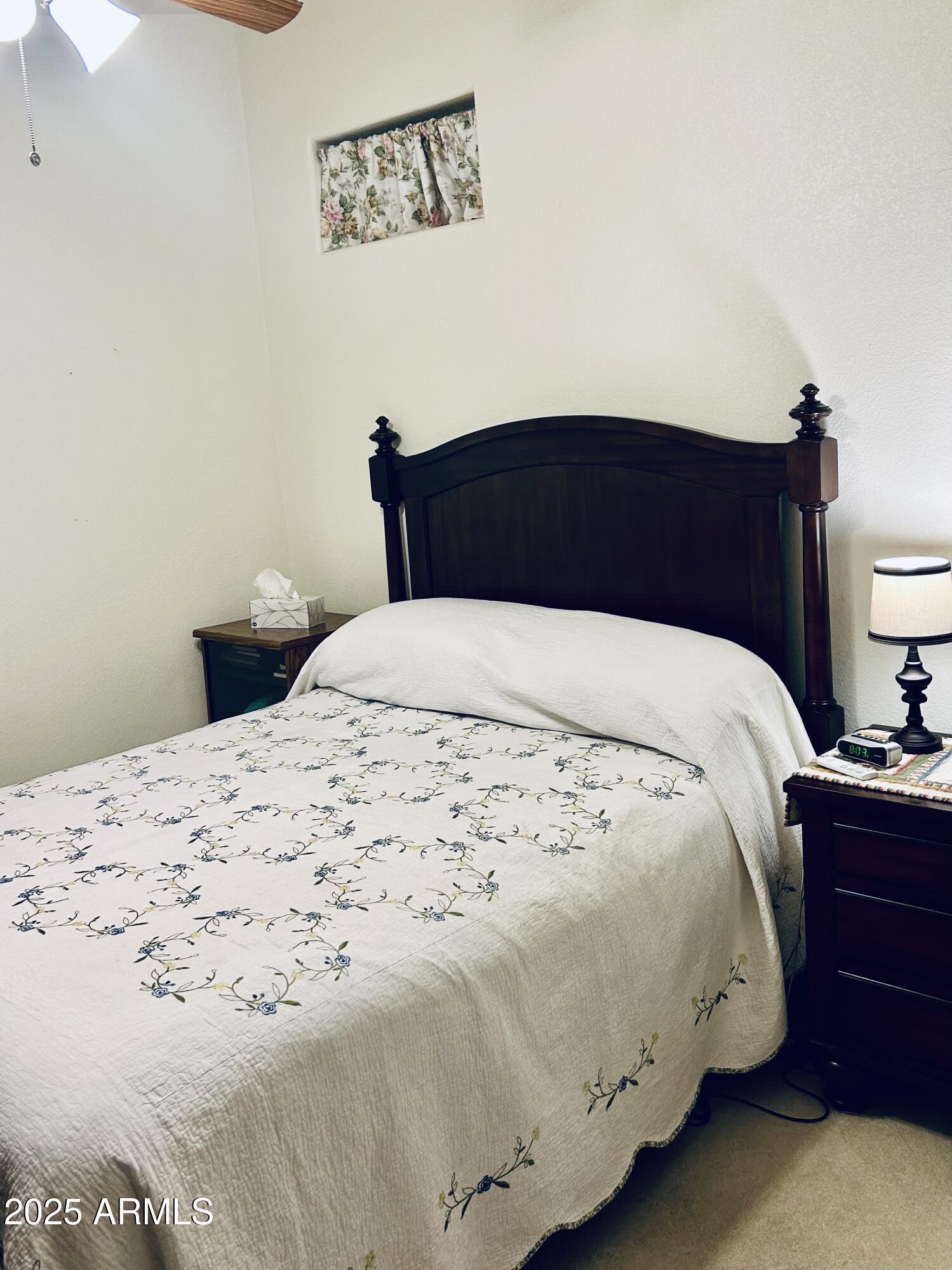 3301 South Goldfield Road, Unit 3011 Apache Junction, AZ 85119 - Photo 20 of 65 a bedroom with a bed and a night stand