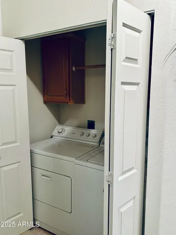 a kitchen with stainless steel appliances a refrigerator sink and cabinets