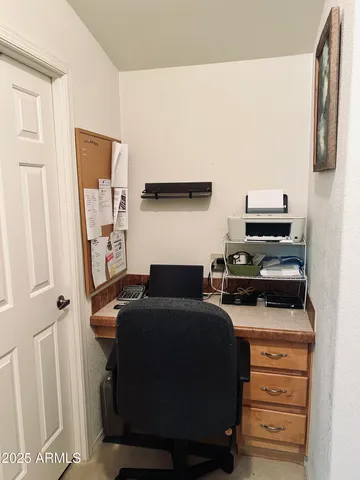 a living room with furniture fireplace and a window