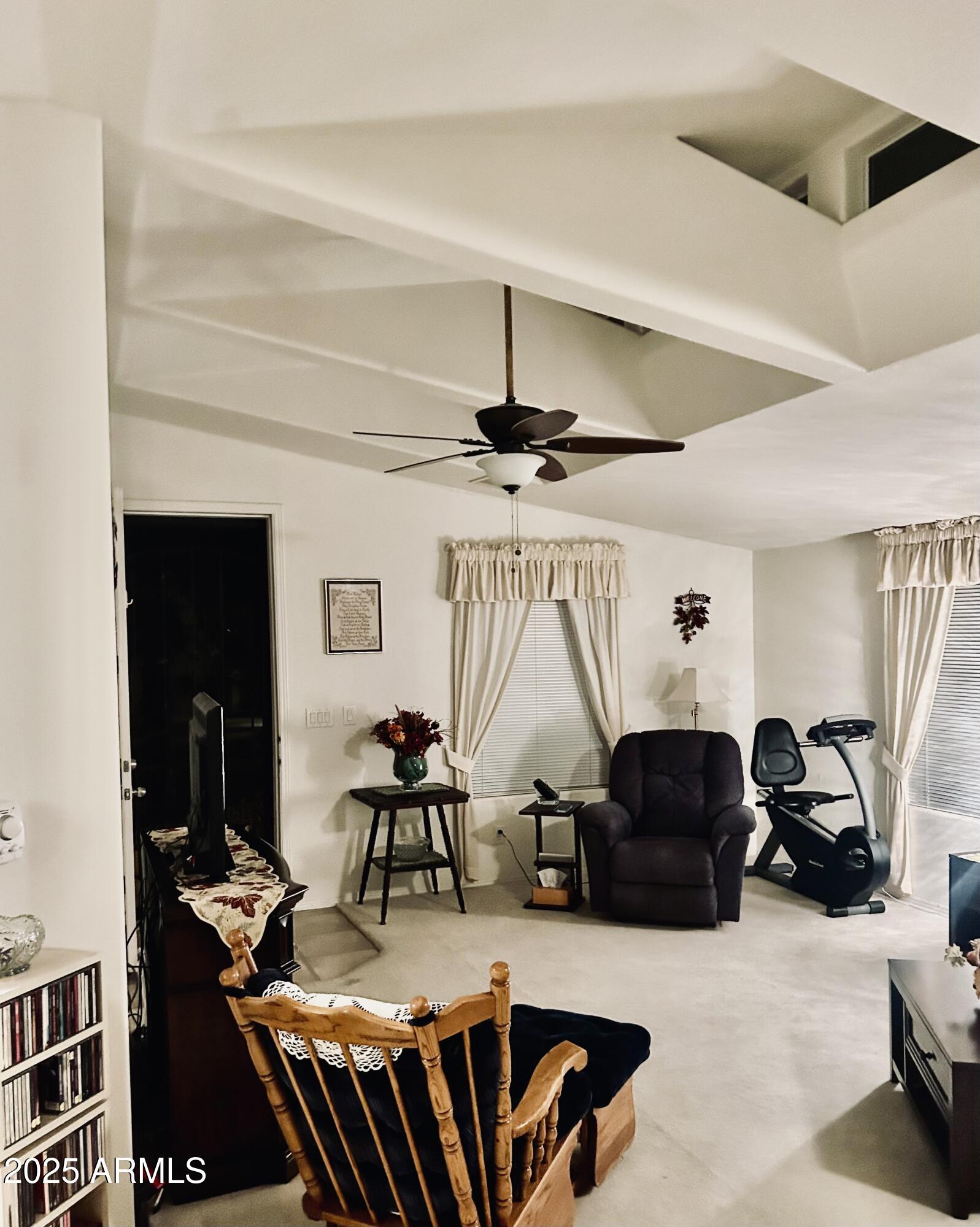 3301 South Goldfield Road, Unit 3011 Apache Junction, AZ 85119 - Photo 31 of 65 a view of a livingroom with furniture and a flat screen tv