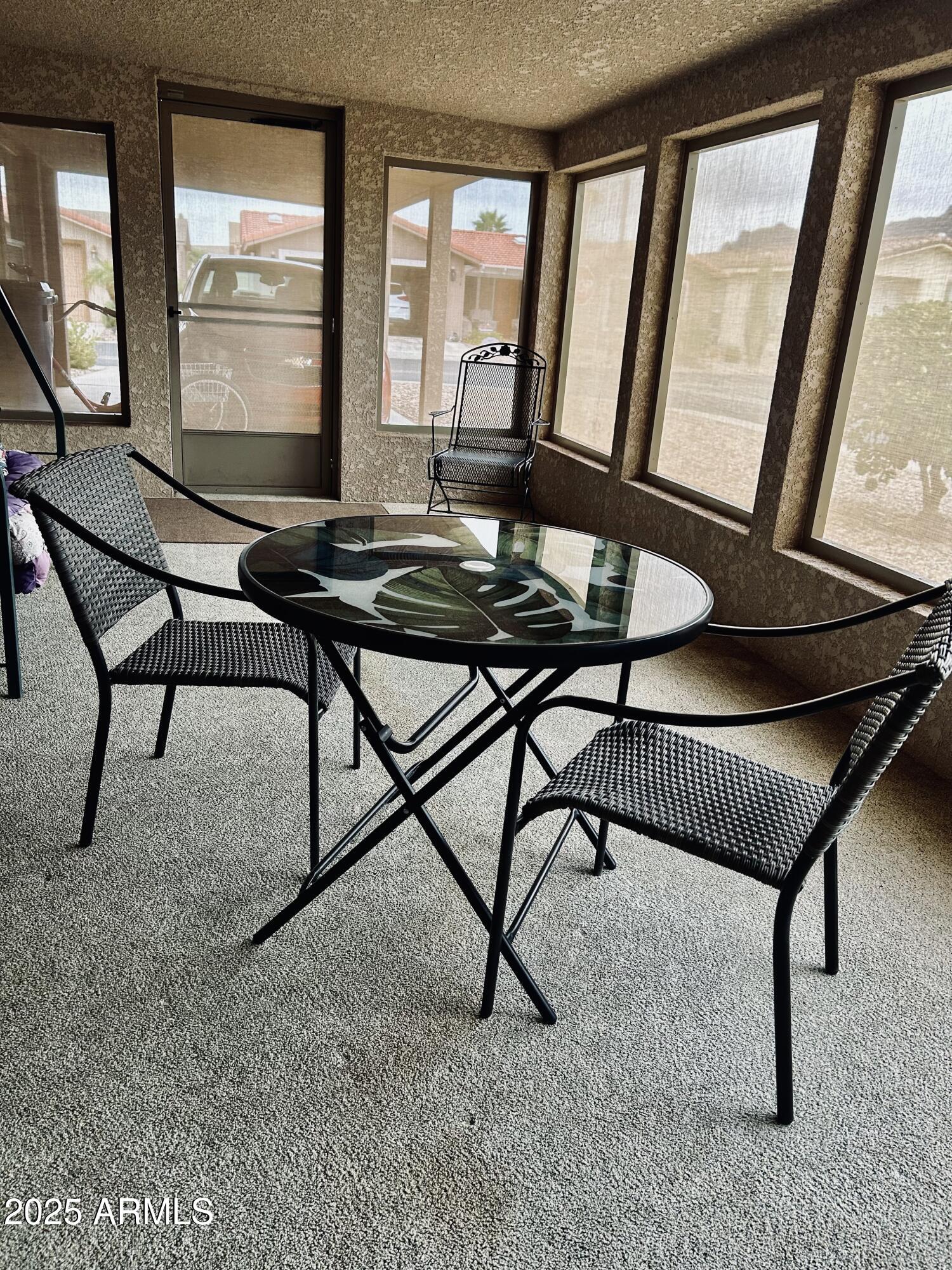 3301 South Goldfield Road, Unit 3011 Apache Junction, AZ 85119 - Photo 39 of 65 a view of a furniture window and wooden floor