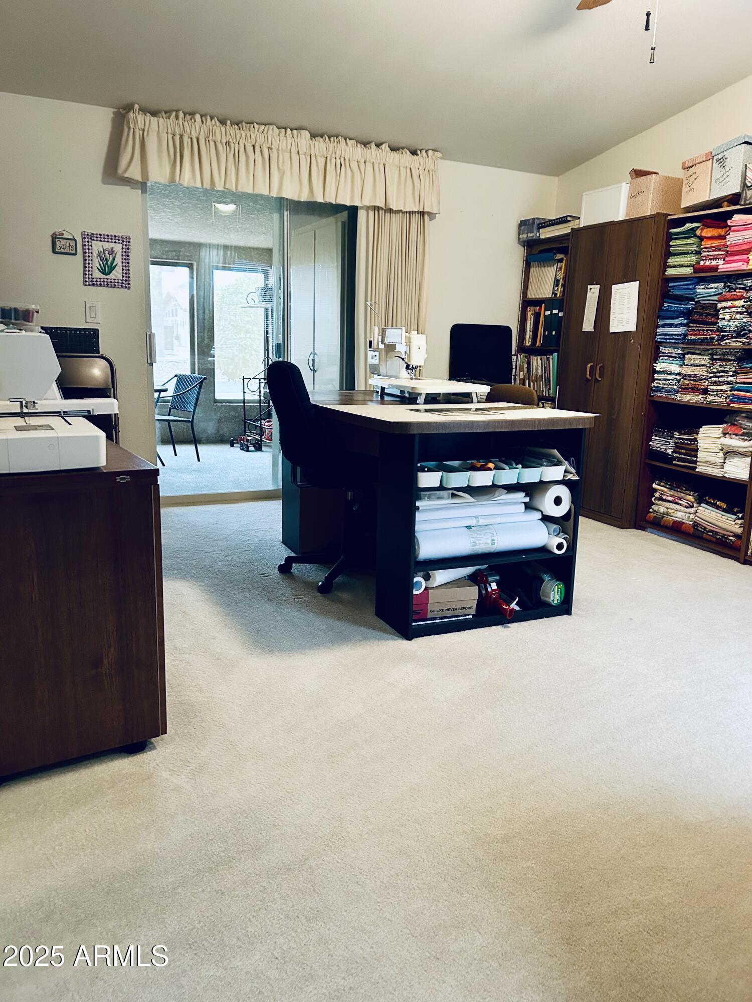 3301 South Goldfield Road, Unit 3011 Apache Junction, AZ 85119 - Photo 40 of 65 a living room with furniture and a flat screen tv