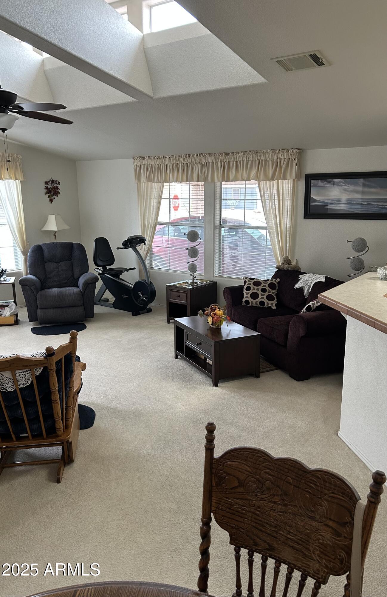 3301 South Goldfield Road, Unit 3011 Apache Junction, AZ 85119 - Photo 41 of 65 a living room with furniture fireplace and a window