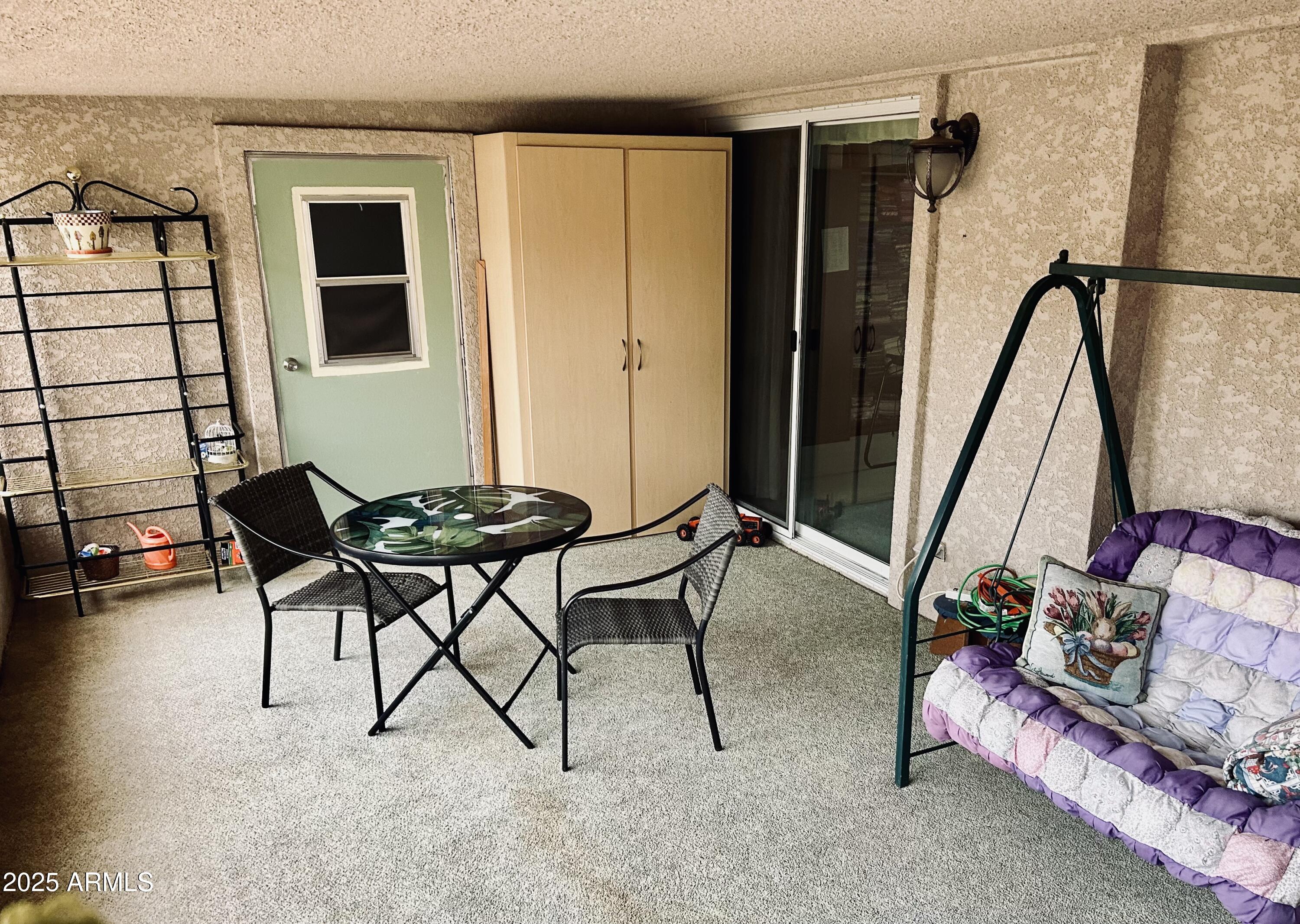 3301 South Goldfield Road, Unit 3011 Apache Junction, AZ 85119 - Photo 42 of 65 a living room with furniture and a window