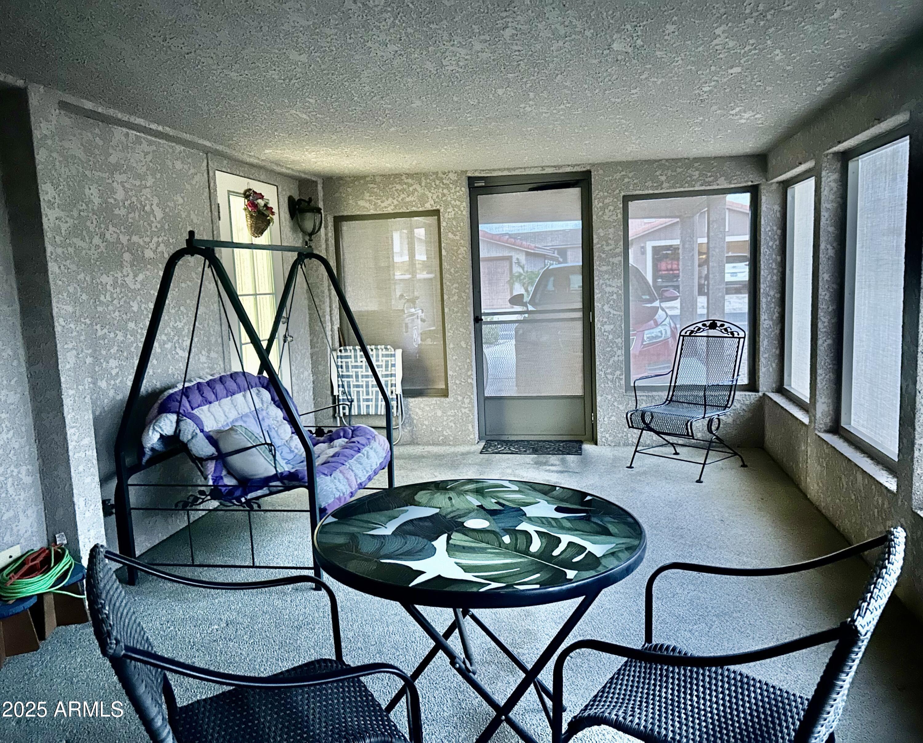 3301 South Goldfield Road, Unit 3011 Apache Junction, AZ 85119 - Photo 9 of 65 a dining room with furniture and window