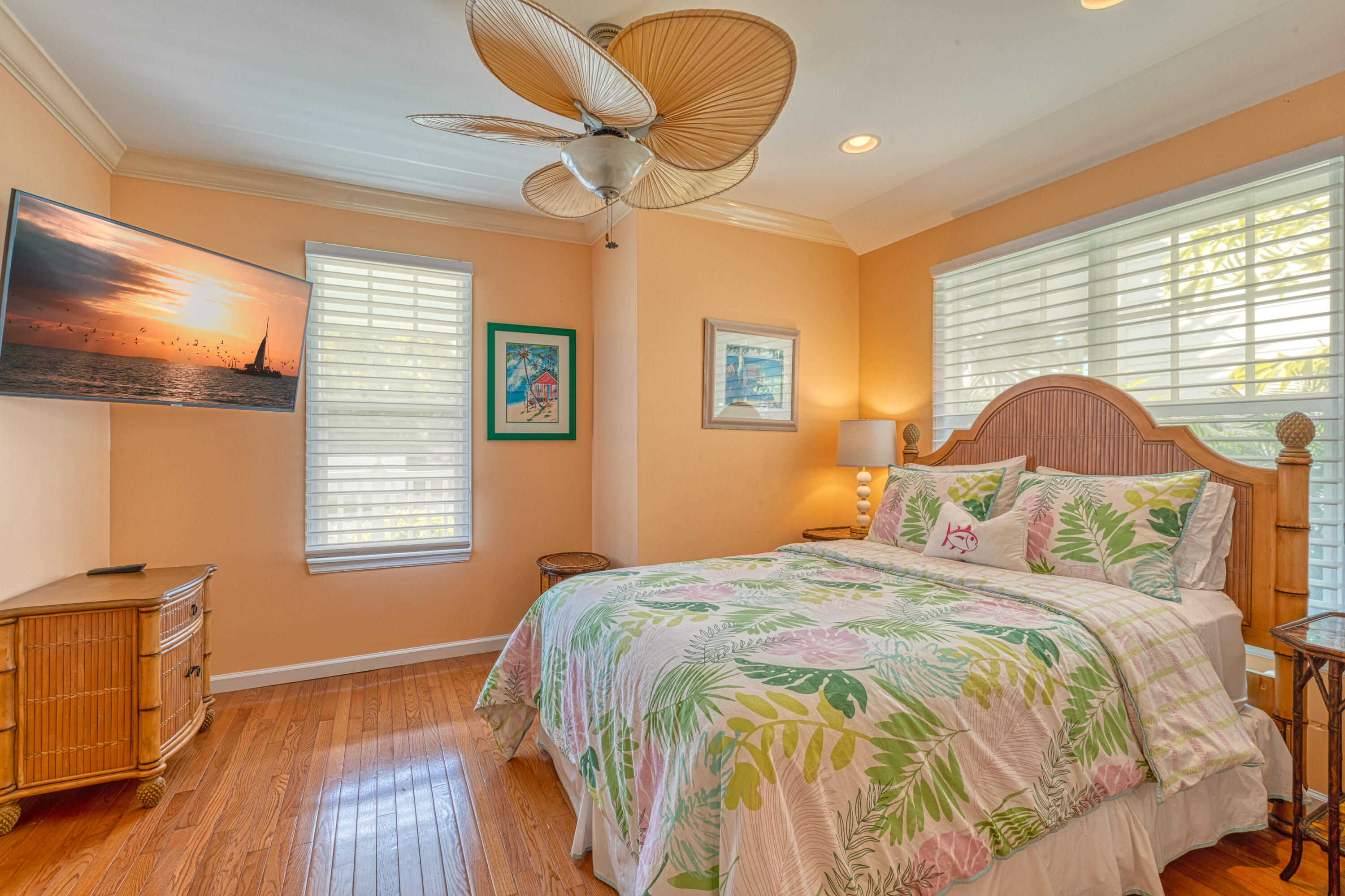 506 Emma Street Key West, FL 33040 - Photo 11 of 24 a bedroom with a bed and wooden floor