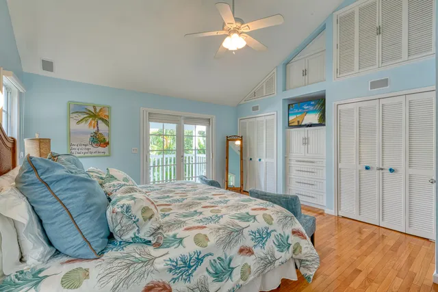 a spacious bedroom with a bed and a window