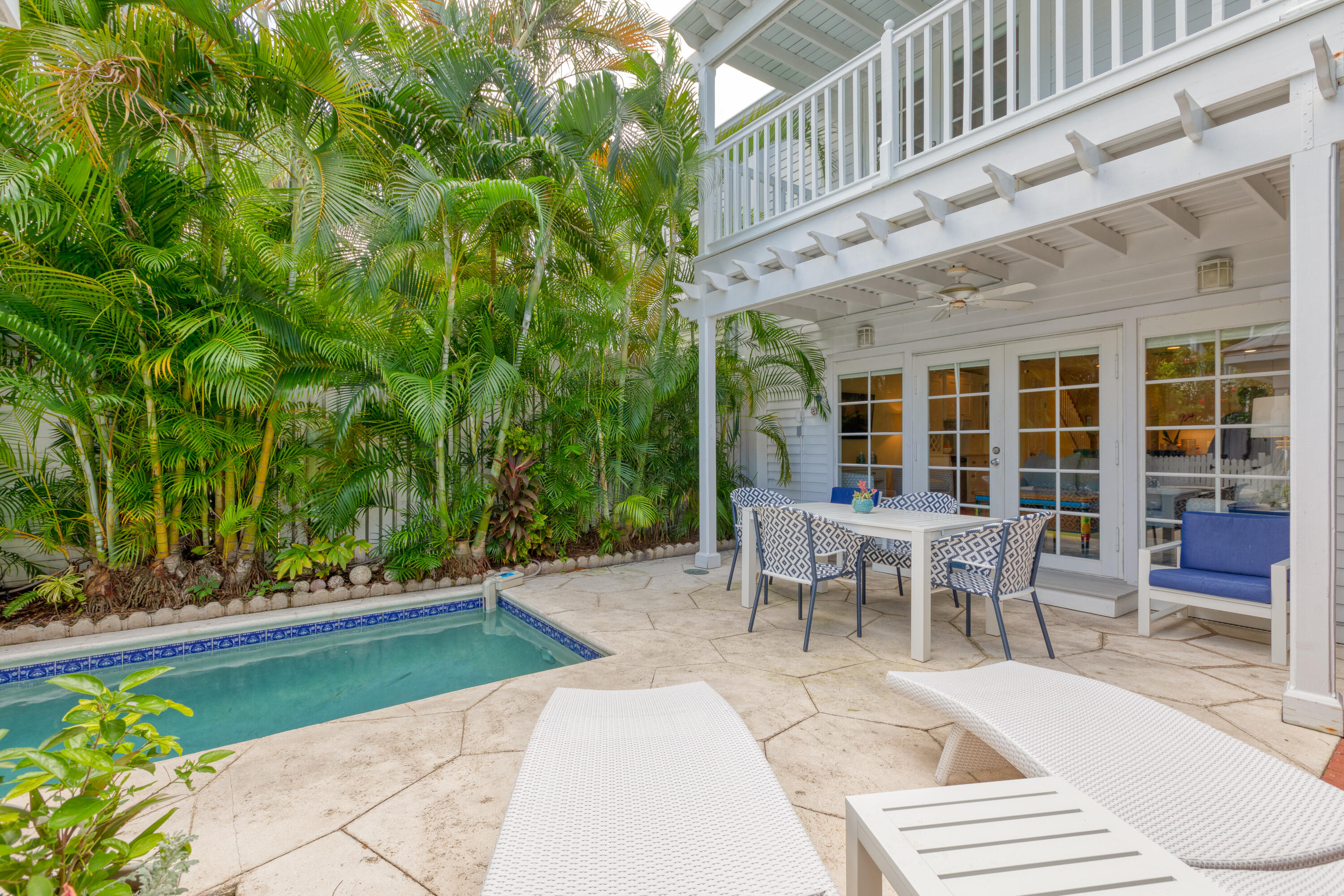 506 Emma Street Key West, FL 33040 - Photo 21 of 24 a view of a patio with table and chairs and potted plants