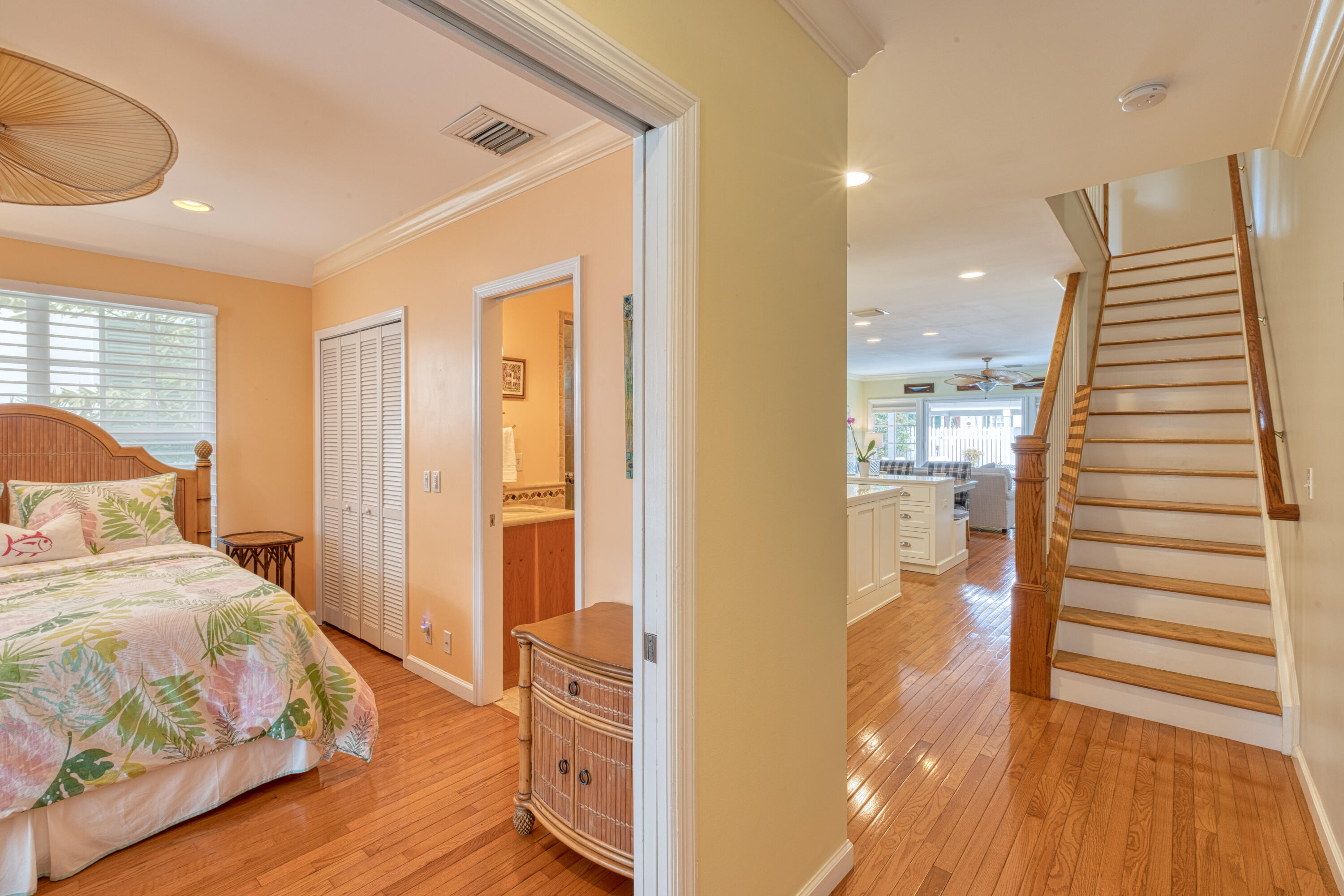506 Emma Street Key West, FL 33040 - Photo 4 of 24 a view of a bedroom with wooden floor and windows