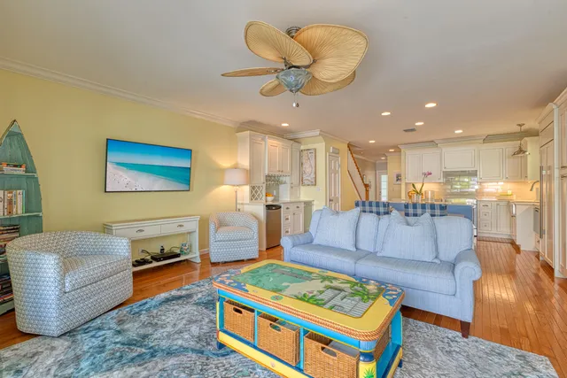 a living room with furniture and a dining table