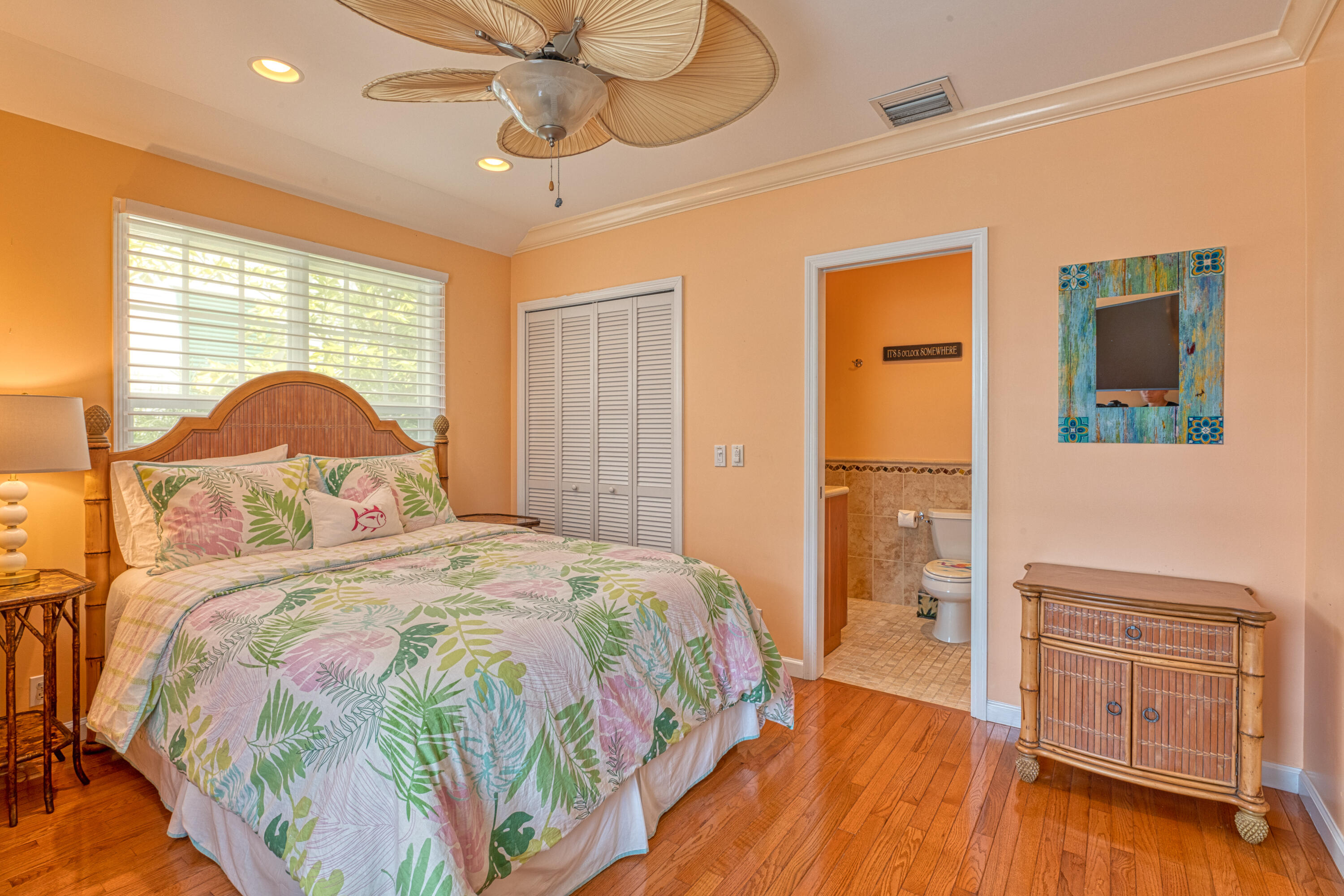 506 Emma Street Key West, FL 33040 - Photo 10 of 24 a bedroom with a bed and wooden floor