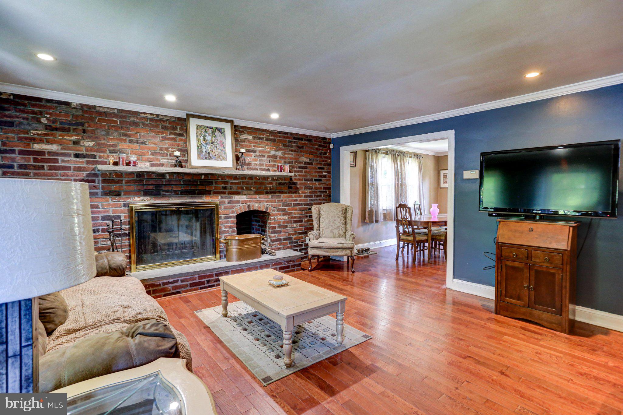 125 West Thomson Avenue Springfield, PA 19064 - Photo 9 of 41 Cozy living space with rustic charm.