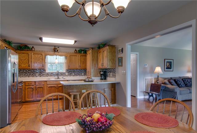 835 Cothran Road Columbia, TN 38401 - Photo 6 of 20 Spacious Kitchen with breakfast bar, tile backsplash, cabinet pantry, & stainless steel appliances! Refrigerator Remains!