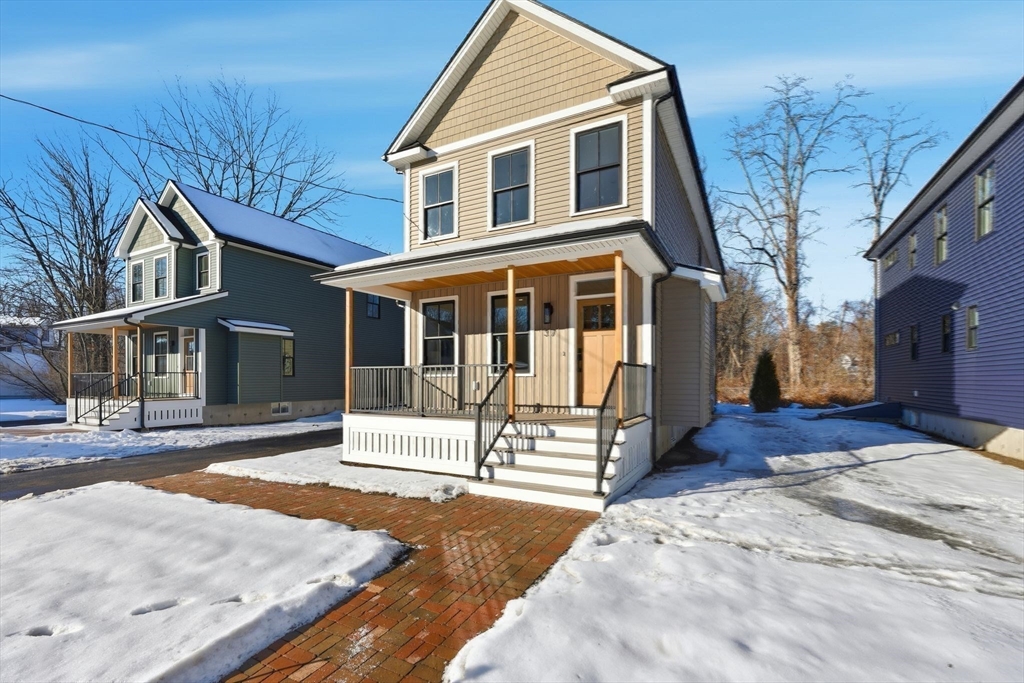37 Landy Avenue Northampton, MA 01062 - Photo 1 of 40 a front view of a house with a yard covered in snow