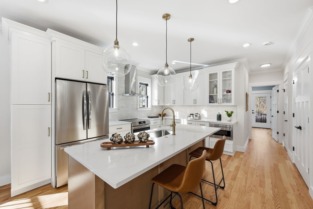 37 Landy Avenue Northampton, MA 01062 - Photo 12 of 40 a kitchen with stainless steel appliances granite countertop a sink a stove a refrigerator and island with wooden floor