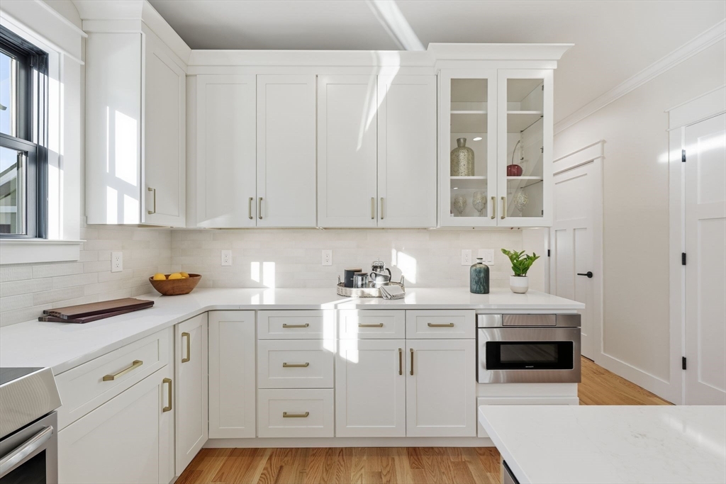 37 Landy Avenue Northampton, MA 01062 - Photo 16 of 40 a kitchen with stainless steel appliances white cabinets and a window