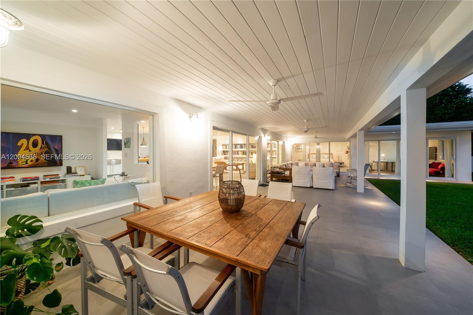 861 Harbor Drive Key Biscayne, FL 33149 - Photo 11 of 33 a dining room with furniture and a floor to ceiling window