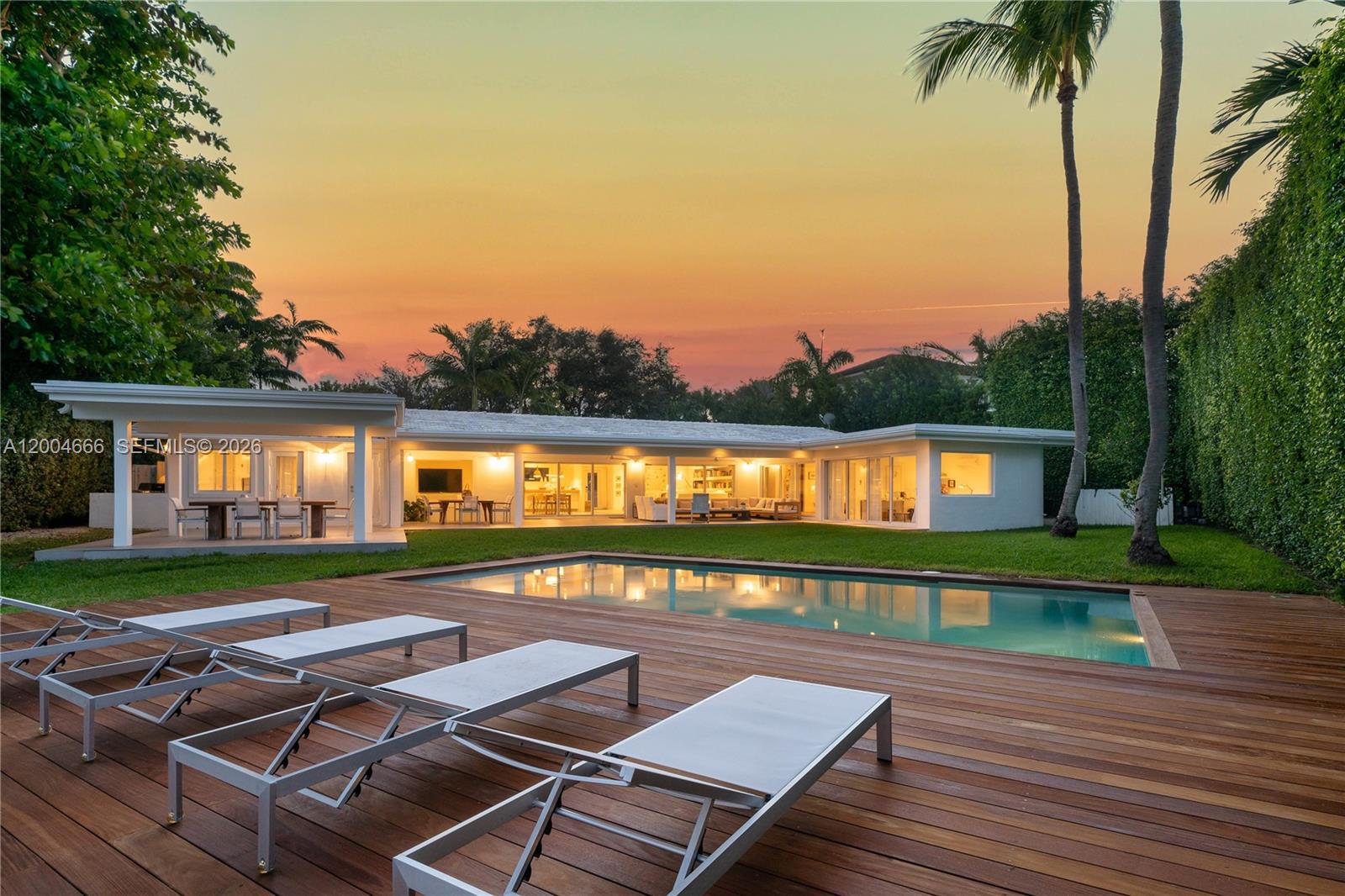 861 Harbor Drive Key Biscayne, FL 33149 - Photo 18 of 33 a view of a swimming pool with a deck