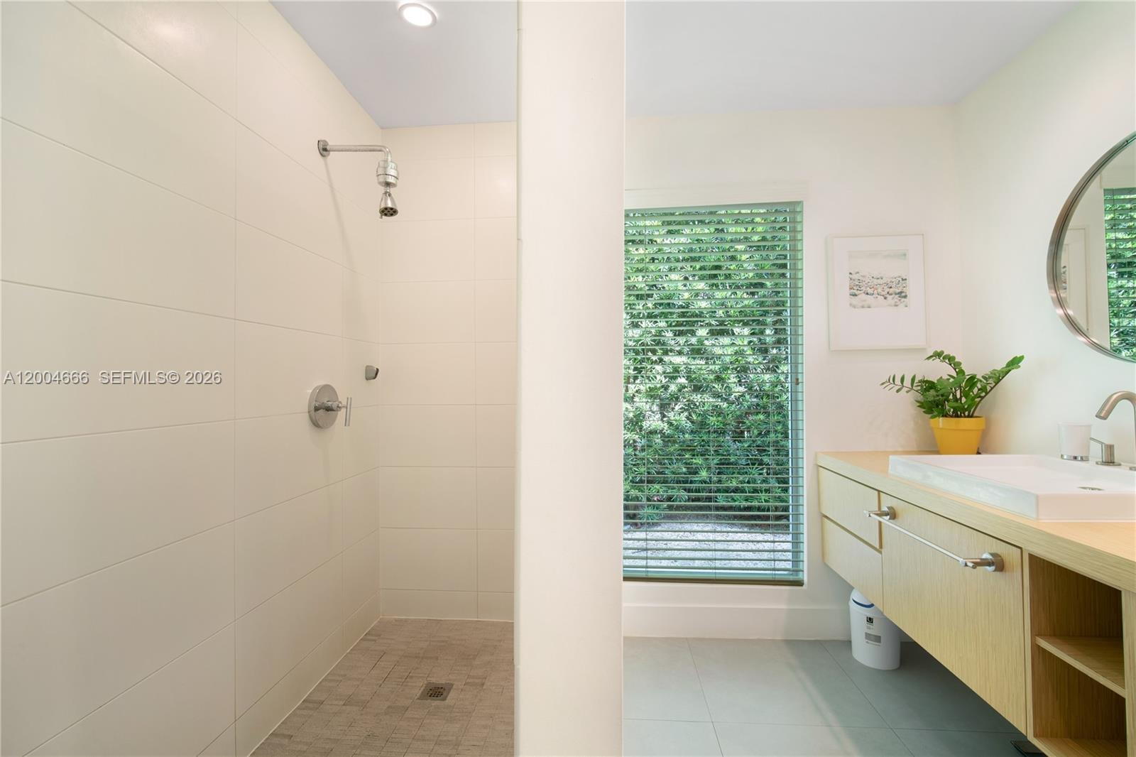 861 Harbor Drive Key Biscayne, FL 33149 - Photo 25 of 33 a bathroom with a shower curtain and a sink