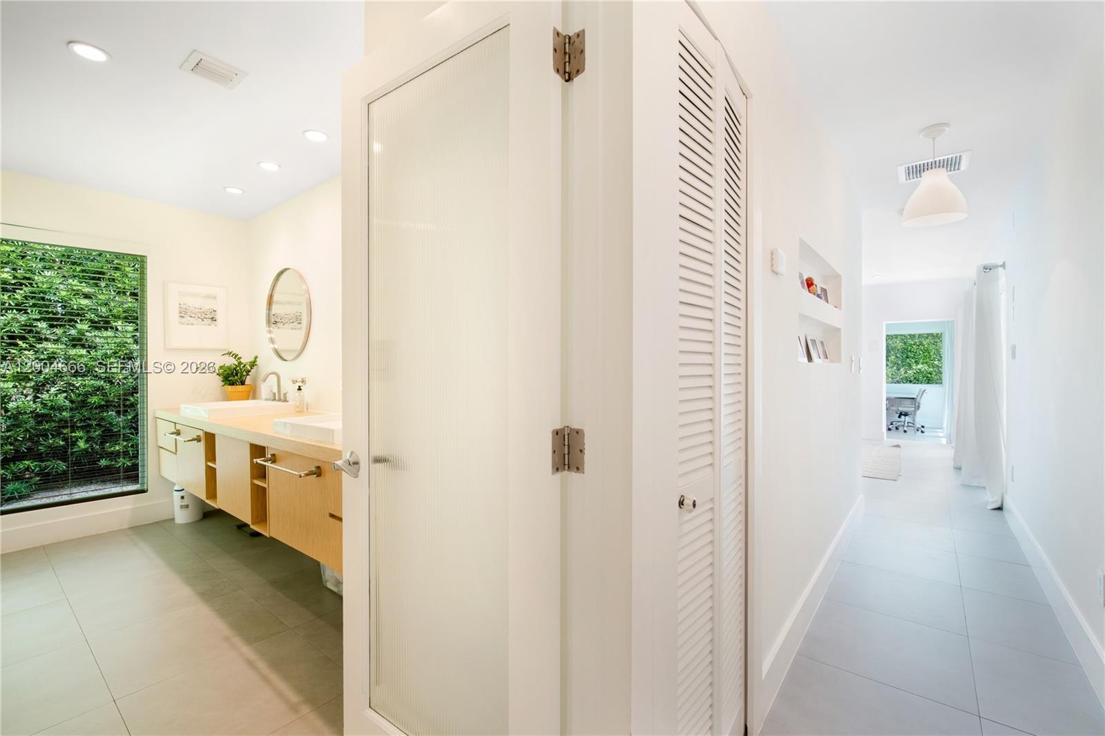 861 Harbor Drive Key Biscayne, FL 33149 - Photo 28 of 33 a bathroom with a sink and a mirror