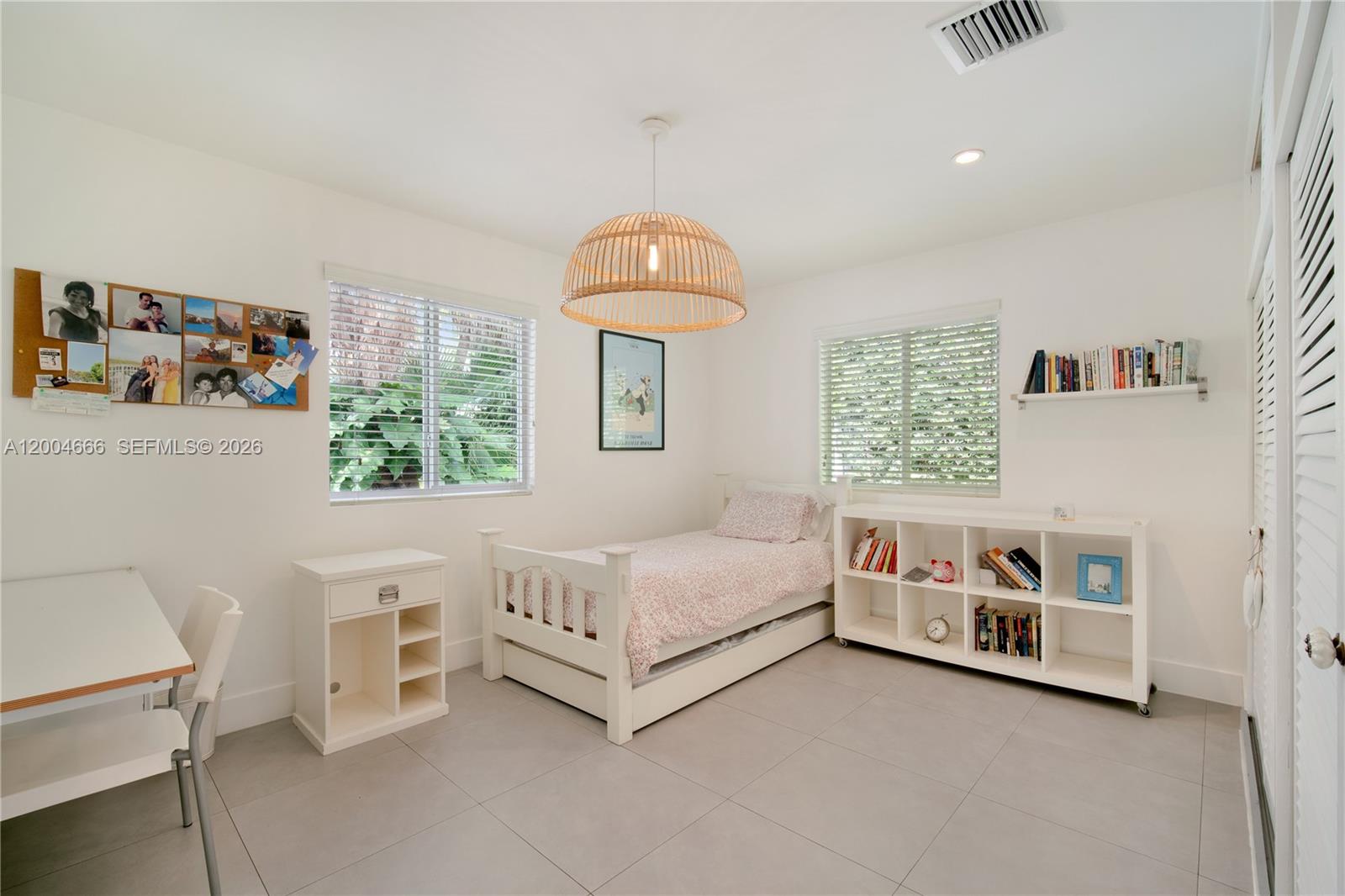861 Harbor Drive Key Biscayne, FL 33149 - Photo 30 of 33 a bed room with a bed and a window