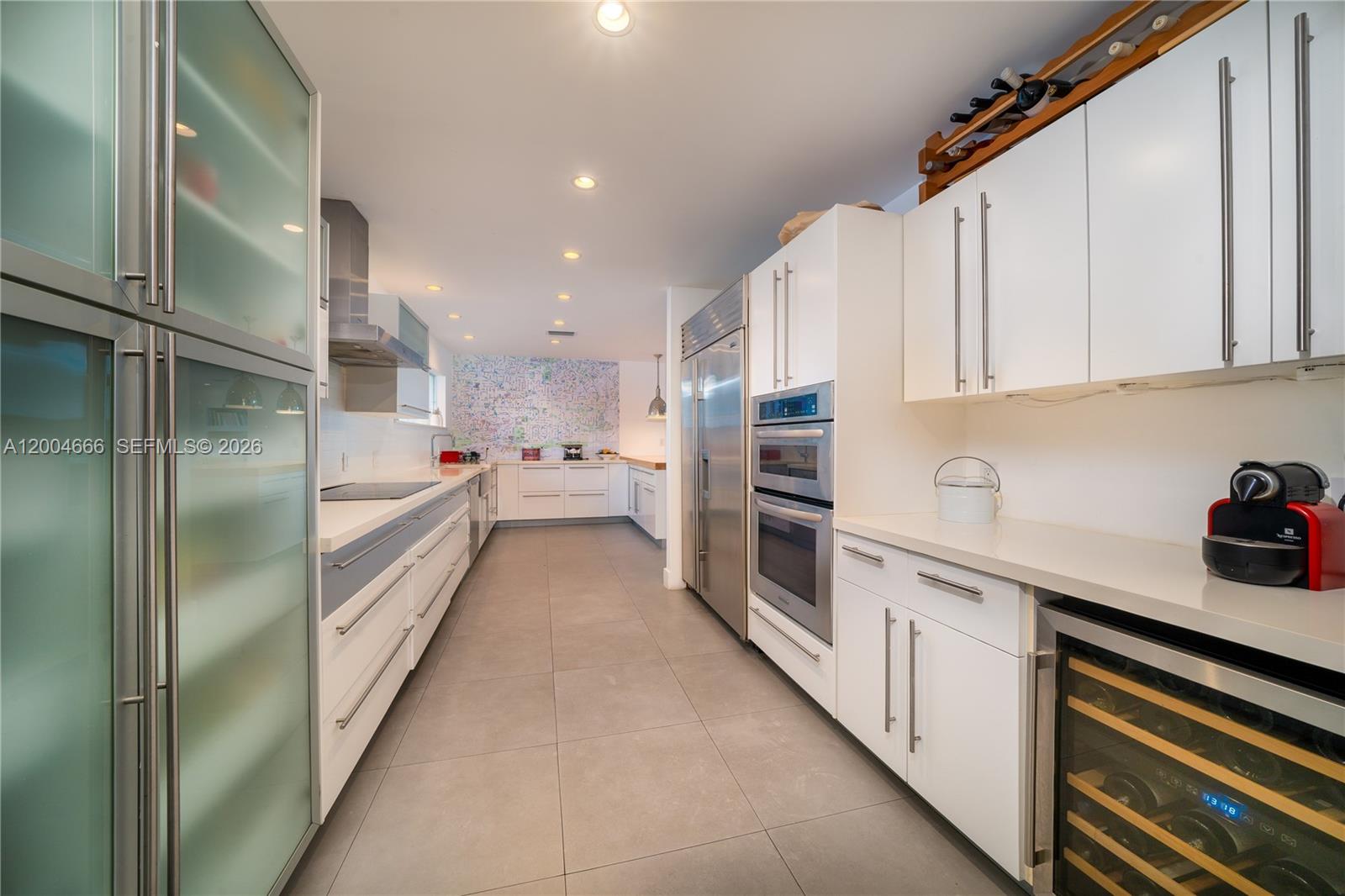 861 Harbor Drive Key Biscayne, FL 33149 - Photo 8 of 33 a kitchen with stainless steel appliances a refrigerator sink and cabinets