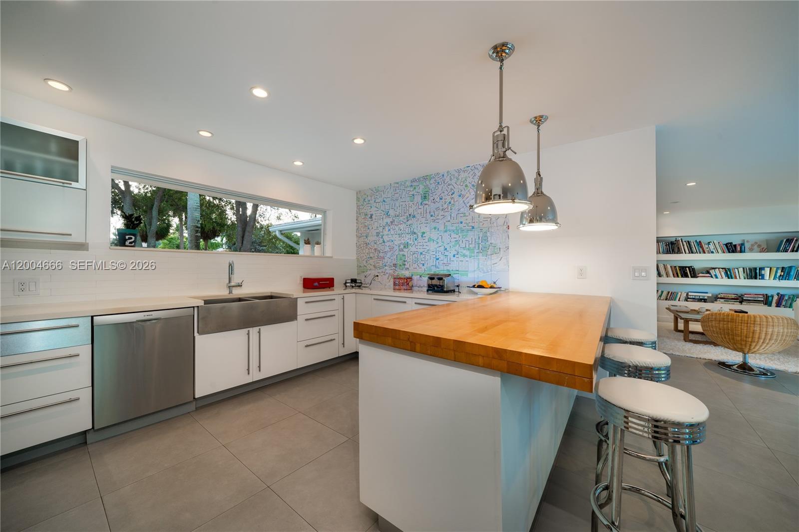 861 Harbor Drive Key Biscayne, FL 33149 - Photo 9 of 33 a kitchen with stainless steel appliances a sink a stove top oven a counter space and cabinets