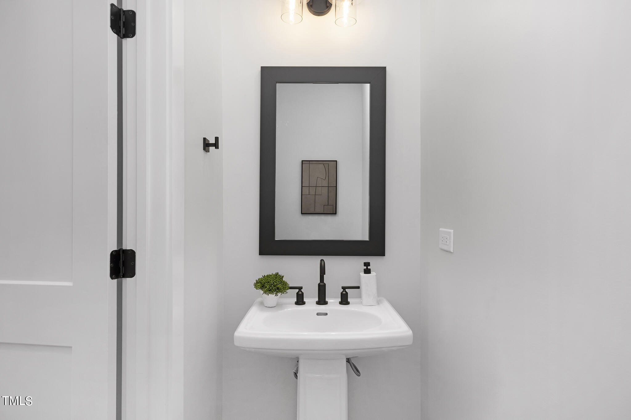 811 Fireship Road Fuquay-Varina, NC 27526 - Photo 16 of 35 a bathroom with a sink and a mirror