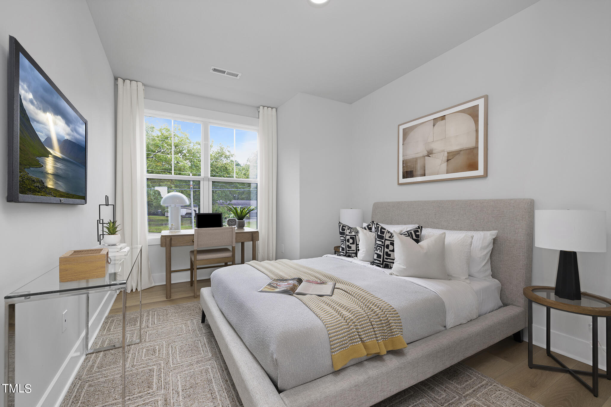 811 Fireship Road Fuquay-Varina, NC 27526 - Photo 23 of 35 a bedroom with a bed and a flat tv screen on the dresser