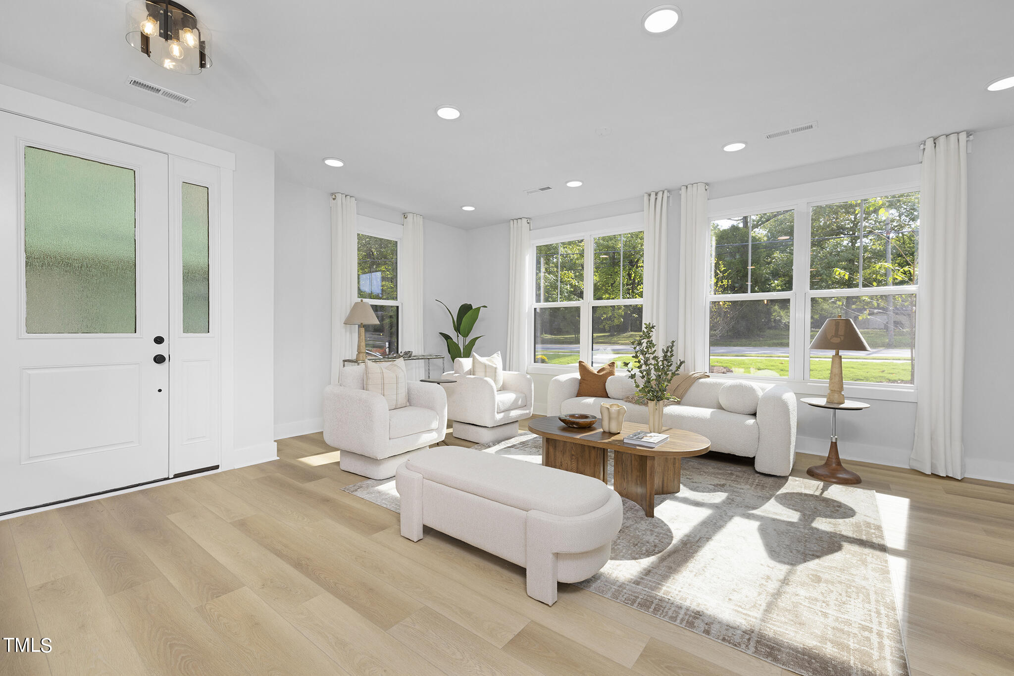 811 Fireship Road Fuquay-Varina, NC 27526 - Photo 3 of 35 a living room with furniture and large windows