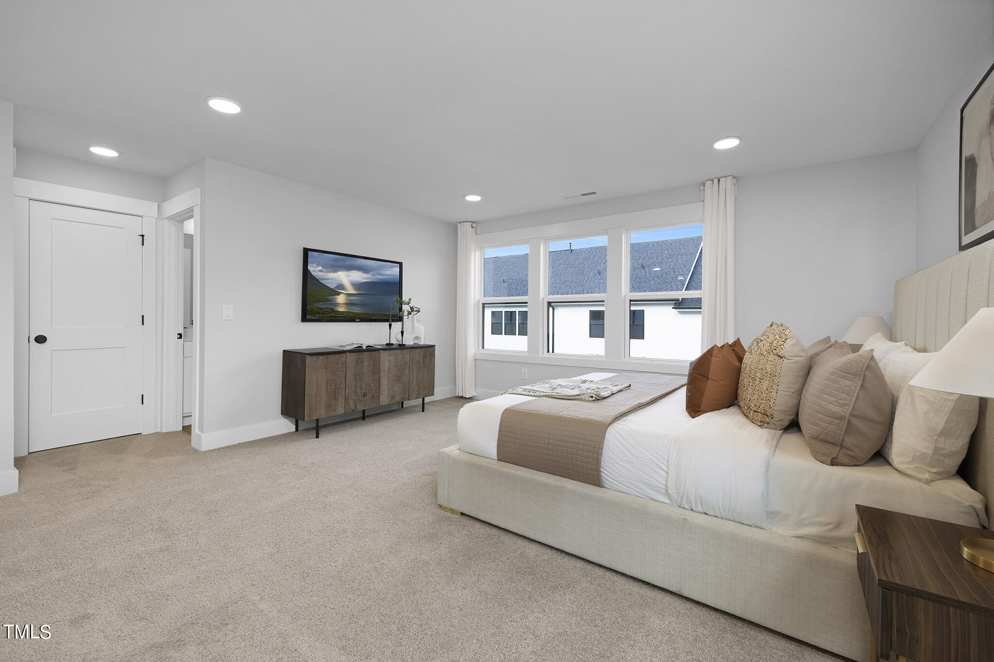 811 Fireship Road Fuquay-Varina, NC 27526 - Photo 31 of 35 a living room with furniture and a flat screen tv