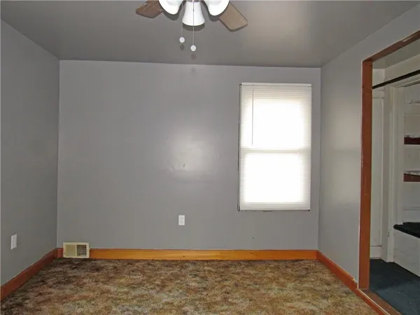 a view of room with window and hardwood floor