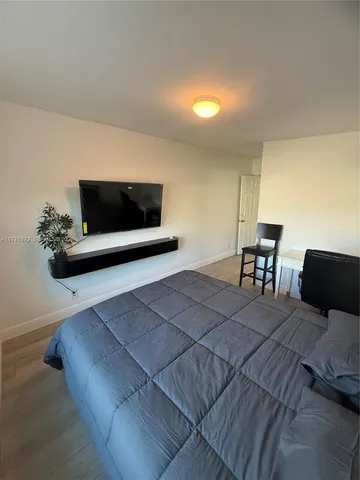a living room with a couch and a flat screen tv