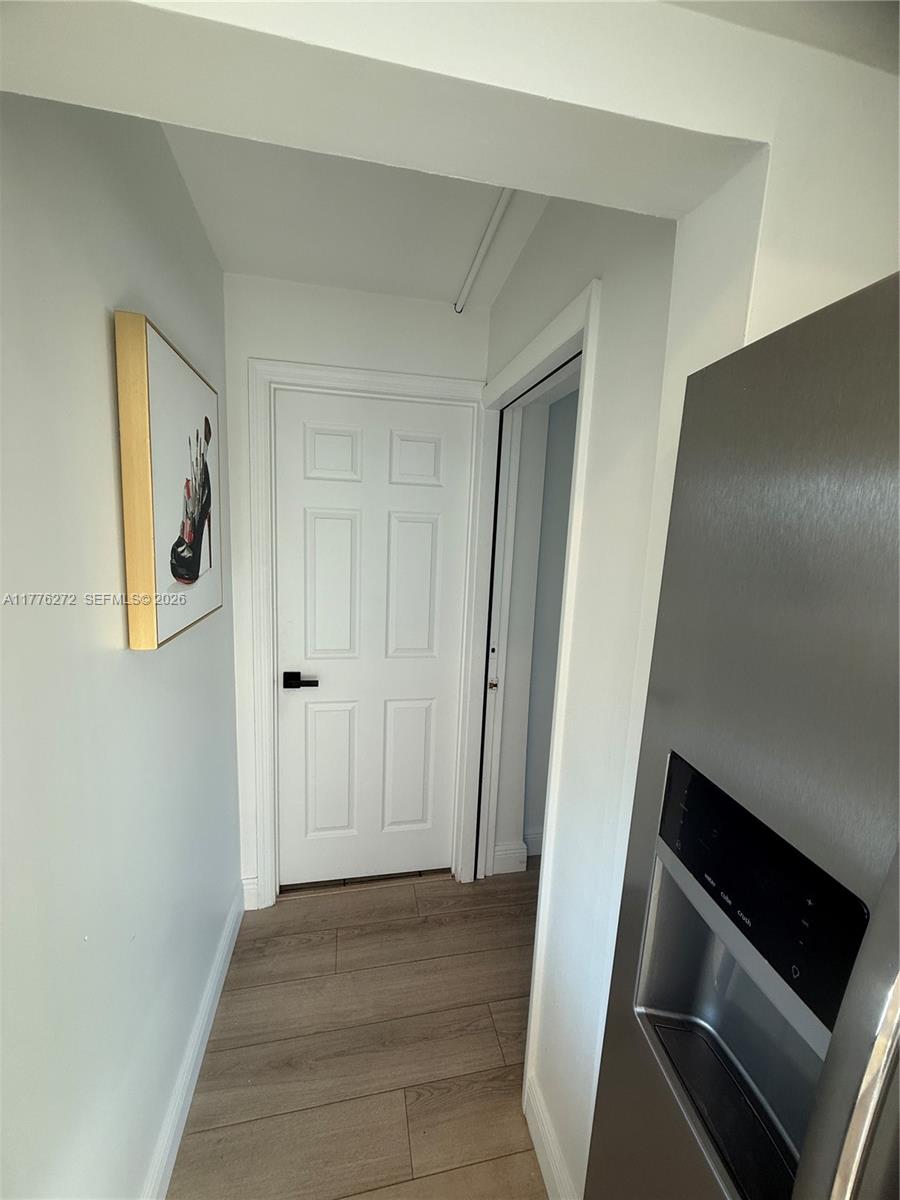 5001 Northeast 23rd Avenue Lighthouse Point, FL 33064 - Photo 19 of 49 a view of an empty room and wooden floor