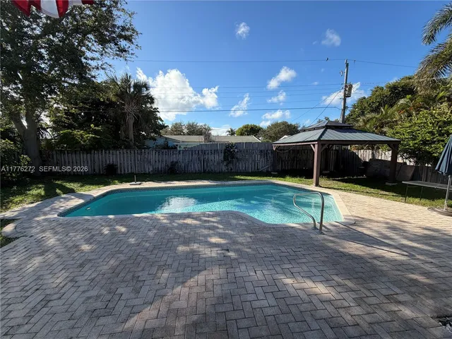 a view of street with tall trees