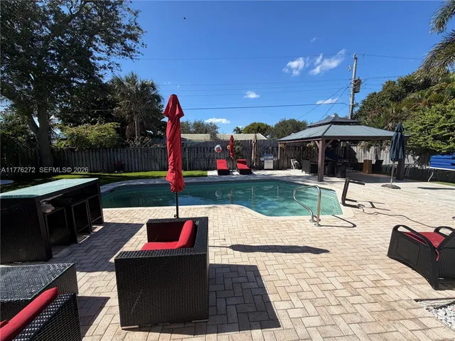 a view of outdoor space with swimming pool and patio