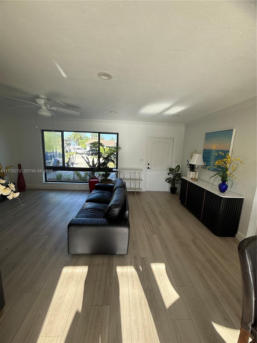 5001 Northeast 23rd Avenue Lighthouse Point, FL 33064 - Photo 7 of 49 a living room with furniture and a large window