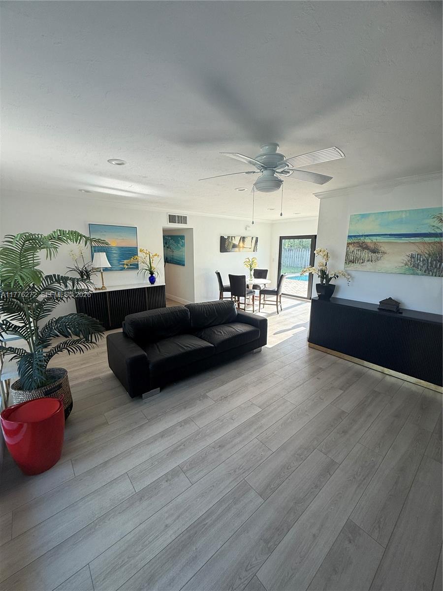 5001 Northeast 23rd Avenue Lighthouse Point, FL 33064 - Photo 9 of 49 a living room with furniture and a large window