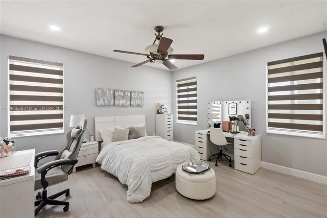 a bedroom with a bed and a television