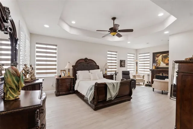 a bedroom with furniture and a window