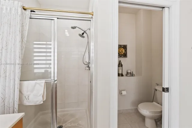 a bedroom with furniture and a flat screen tv
