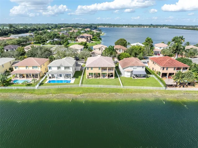 an aerial view of a house with a lake view