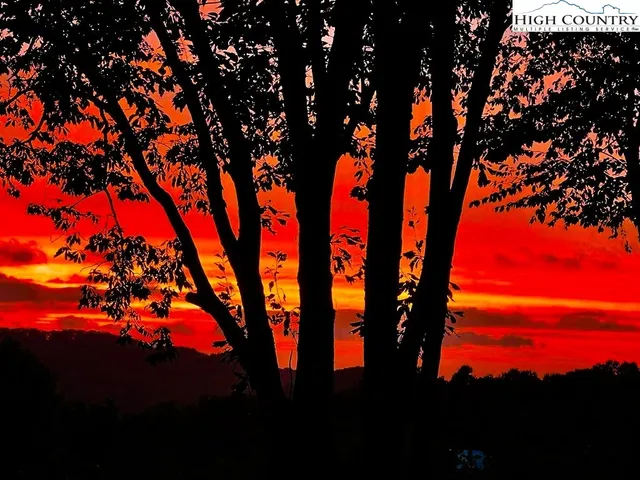 a view of balcony with chairs and wooden floor