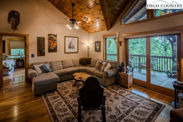 a view of a roof deck with wooden fence